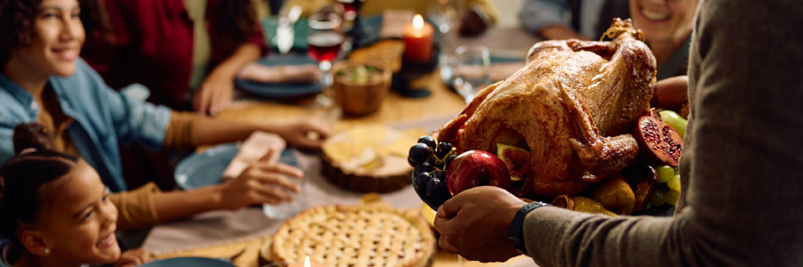 Image of a family enjoying Thanksgiving dinner