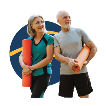 Two people holding yoga mats
