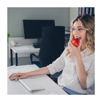 A person sitting eating an apple