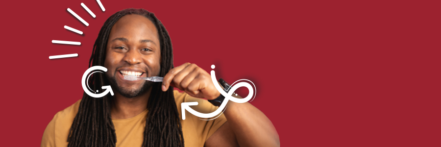 Image of smiling person holding toothbrush to their mouth