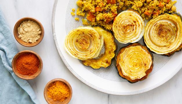 Natural Grocers Moroccan-Inspired Roasted Acorn Squash Served with Curried Quinoa Pilaf
