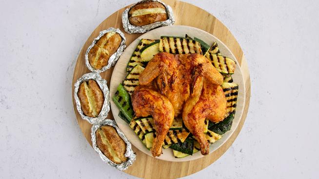 BBQ Spatchcock Chicken with Baked Potatoes and Grilled Zucchini